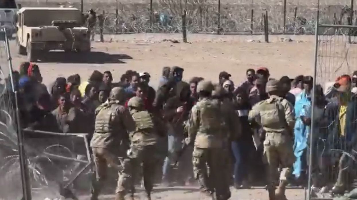 'This is an invasion': Shocking video footage shows mob of angry migrants breach border, rush National Guard soldiers